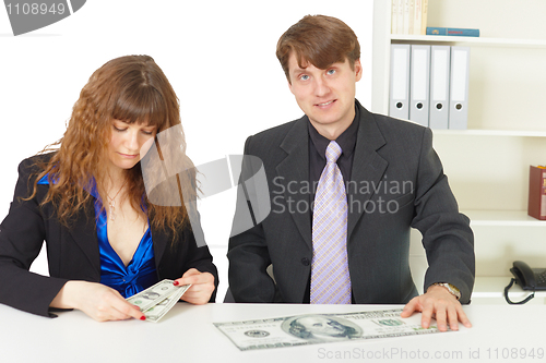 Image of Man and woman have different wages