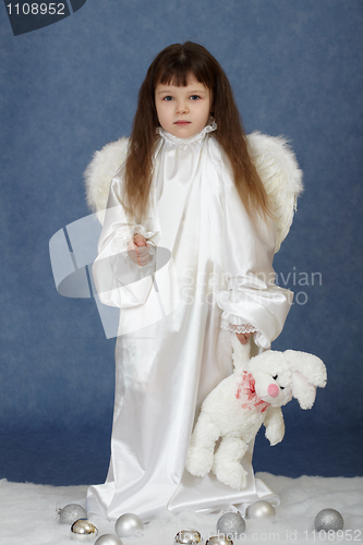 Image of Little girl dressed as an angel with rabbit
