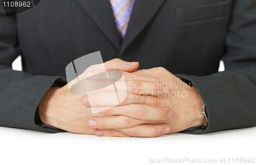 Image of Hands on white table