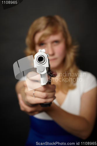 Image of Woman aiming a gun