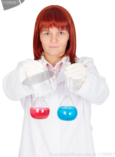 Image of Woman - scientist holding flasks with colored liquids