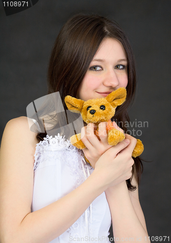 Image of Portrait of teenage girl with favorite toy