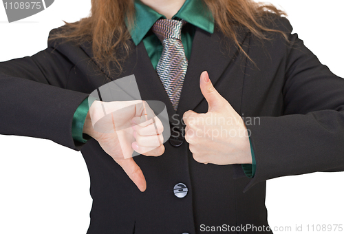 Image of Woman shows gestures - thumbs upwards and downwards