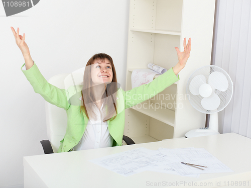 Image of Jubilant woman at his workplace in office