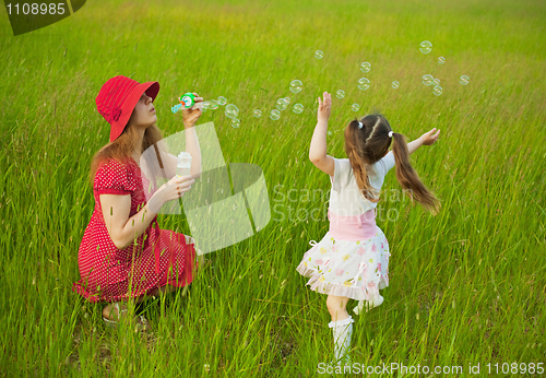 Image of Mum and daughter starting up soap bubbles