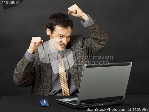 Image of Man - football fan, watches football match in Internet