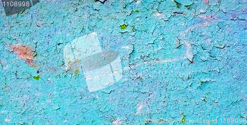 Image of Blue wall covered with grunge old cracked paint