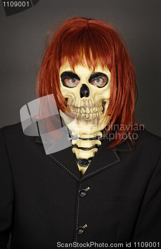 Image of Funny man in mask a skull and wig