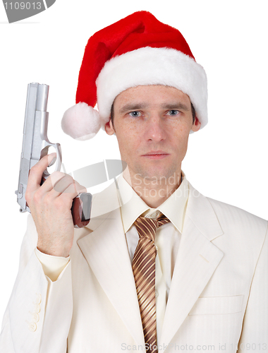 Image of Young man in Christmas hat with gun