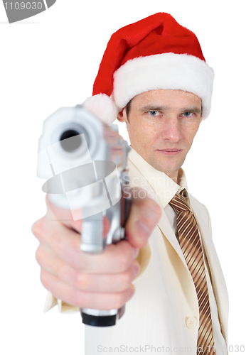 Image of Guy in Christmas hat aiming a gun