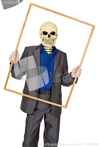 Image of Man dressed as skeleton in wooden frame