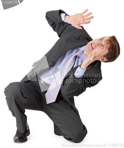 Image of Frightened businessman sitting on white background