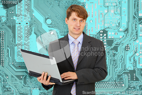 Image of Smiley Engineer - electronics with computer