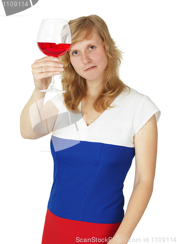 Image of Girl looks at a glass of red wine on white