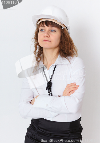 Image of Serious engineer - builder in white helmet