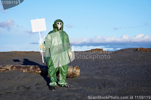 Image of Man in overalls holding a white plate