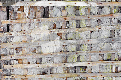 Image of Ruined wall with wooden lattice - background