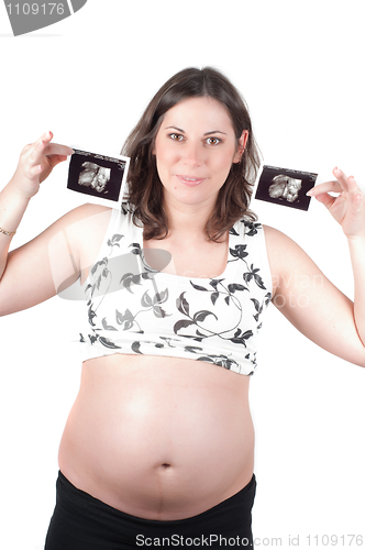 Image of Young woman holding a sonogram of her child