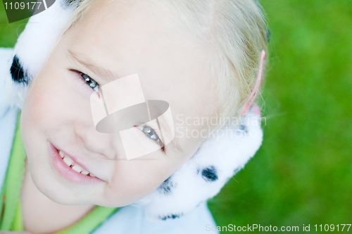 Image of Little girl playing outside