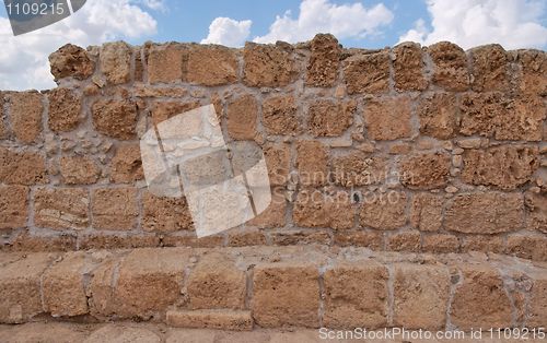 Image of Ancient yellow stone wall texture