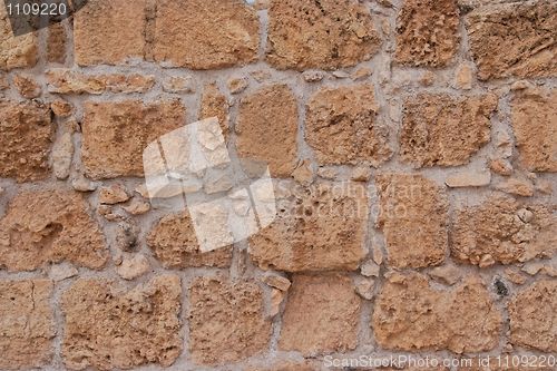 Image of Ancient yellow stone wall texture