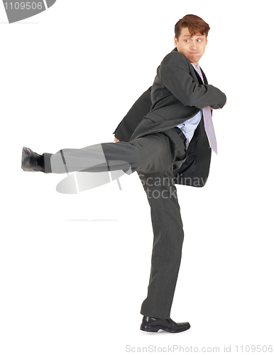 Image of Businessman showing karate kick