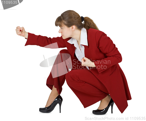 Image of Young woman strikes at hand