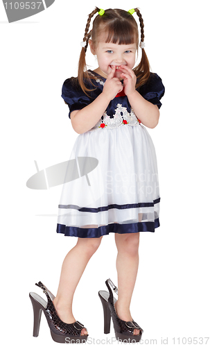 Image of Girl dressed big shoes, isolated on white