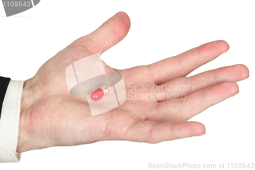 Image of Hand with red pill, white background