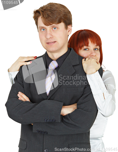 Image of Woman behind man like stone wall