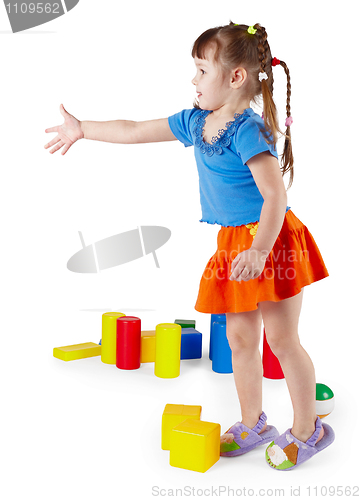 Image of Little girl in dress with toys on white background