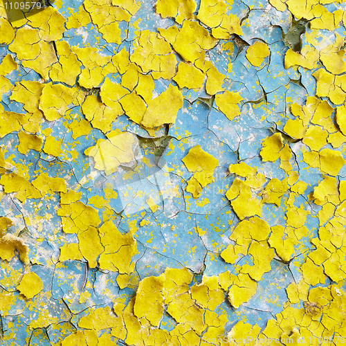 Image of Yellow wall covered with scraps of paint