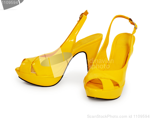 Image of Pair of yellow female shoes isolated on white background