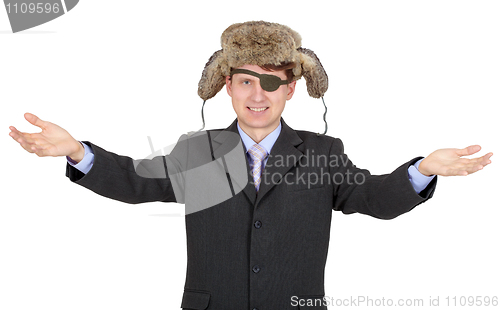 Image of Portrait of young businessman with a eye-patch in fur hat