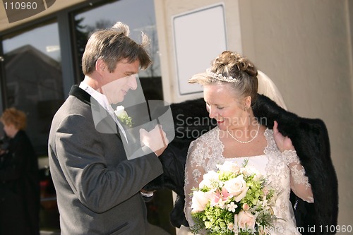 Image of helping the bride