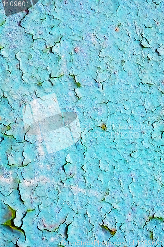 Image of Blue paint is chipping on wall