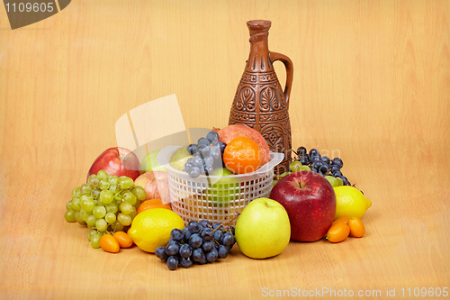 Image of Still life of fruit and ceramic bottle