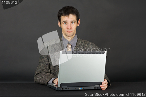 Image of Man working with laptop computer