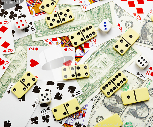 Image of Gambling background with dominoes and money