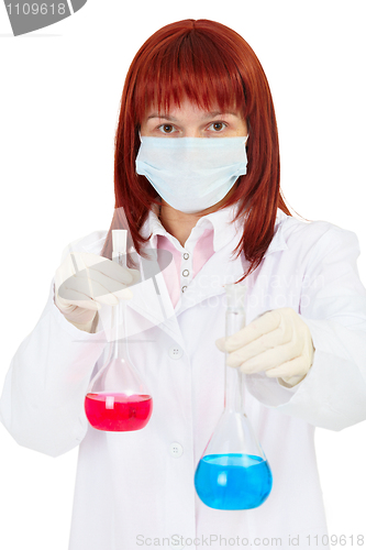 Image of Young woman - scientist with chemical reagents