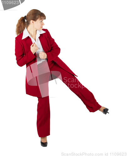 Image of Beautiful girl in business suit kicks