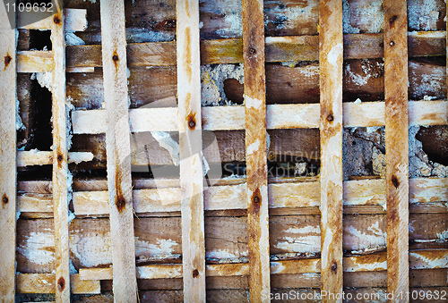 Image of Old wooden lattice - old skeleton of concrete wall