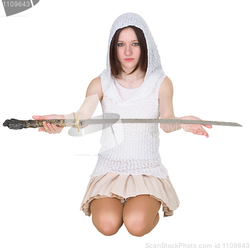 Image of Teenage girl sitting on the lap with traditional Japanese sword 