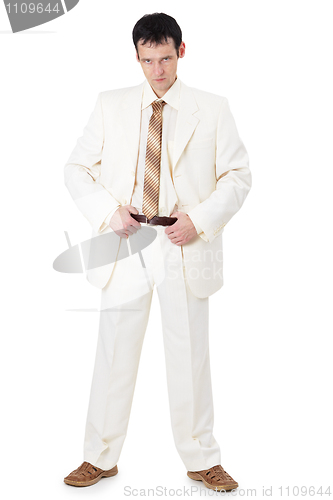 Image of Stern businessman in a light suit
