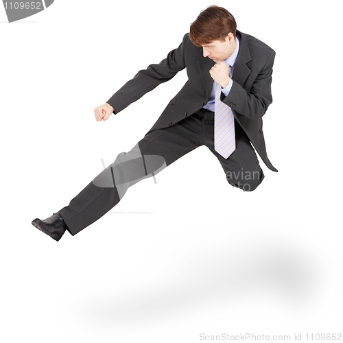 Image of Fighting businessman kicked in jump, isolated on white backgroun