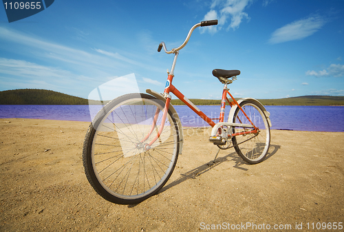 Image of Old-fashioned bicycle on summer beach