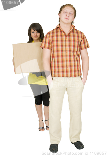 Image of Woman and man bear the big cardboard box