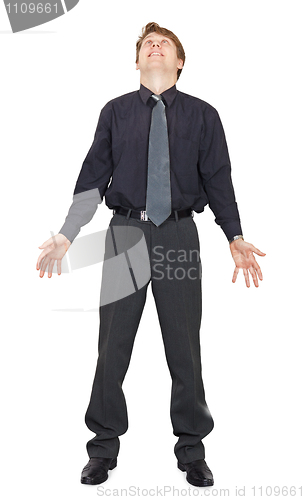 Image of Happy man stands and looks up