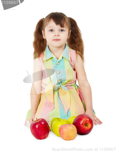 Image of Little girl with apples sits isolated on white background