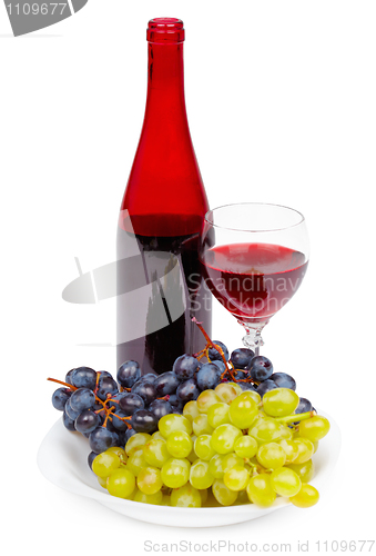 Image of Bottle of red wine, glass and grapes on white background